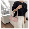 2024 Nuevo bolso de moda Pequeño bolso de mujer minimalista francés nuevo bolso de hombro súper caliente de moda y de moda, bolso cruzado versátil de color sólido para las axilas