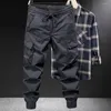 Calças masculinas calças compridas multi-bolso macacão carga com cordão com cintura elástica multi bolsos design com faixa de tornozelo para uso diário