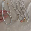 Collane con ciondolo Collana di perle retrò Camelia Tulipano Farfalla Stile francese Ins Design Barocco Elegante Maglione Catena Accessori fata