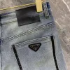 Högkvalitativa män jeans designer byxor män smal liten rak bomull casual denim byxor modea triangel logotyp brev grafiska denims byxor