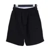 Pantalones cortos para hombres 24SS nuevos pantalones cortos con letras a cuadros impresas para hombres sueltos casuales hip-hop de gran tamaño deportes elásticos playa H240401