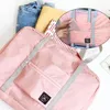 Sacos de armazenamento Bolsa de viagem de grande capacidade Bolsas de bagagem Dobrável Organizador de mala à prova d'água Roupas unissex Tote