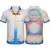 Casa Blanca T 셔츠 새로운 2023 여름 카사 블랑카 남성 캐주얼 정장 플립 칼라 짧은 슬리브 셔츠 팬 모양의 느슨한 착용감
