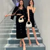 Jupes Jupe longue noire de la marque de créateur Miu Miao, jupe simple boutonnage, luxueuse et velours polyvalente exquise en une étape pour l'hiver K0ZU