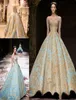 Michael Cinco 2019 Ball Gown Abiti da ballo Vintage Gold Lace Sweep Train Abiti da sera Plus Size Illusion Manica lunga Arabo Party 4024995