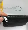2024 Luksusowy projektant kluczowy łańcuch nylonowa torebka płótno mężczyźni kobiety mini portfele breloki czarne zamykanie torebki kieszonkowe lęk breliza
