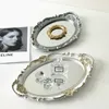 Europejski dekoracyjny taca do przechowywania taca Owalna płyta biżuteria Rotary Candy Decor Decor Tray Mirror Dekoracyjne lustro 240315