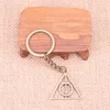 Nyckelringar 20st Fashion Keychain 32mm Deathly Hallows Hängare Diy Men smycken bil Key Chain Ring Holder Souvenir för gåva