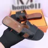 Mode tofflor kvinnor designer sandaler för kvinnors tofflor mens casual loafers skor utomhus strandskivor platt botten med spänne unisex äkta läder g601f