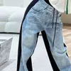 Famiglia P di fascia alta 24SS Inizio primavera Nuovo denim patchwork di cotone colore lungo con pantaloni casual in denim con decorazione hardware triangolare