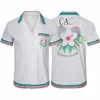Chemise Casablanc Homme 2024 قمصان مصمم زر أعلى قميص طباعة رجال قميص غير رسمي للسيدات الحرير فضفاضة قميص قصير القميص