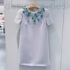 Robes décontractées basiques Robe à col rond de tempérament de la marque de créateur Miu Miao, jupe à manches courtes haut de gamme à fleurs perlées fabriquées à la main, nouveau modèle printemps 2023 IB4T