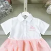 Markendesigner-Kinderkleidung, Mädchenkleider, Taillendesign, Kleinkindrock, Spleißdesign, Prinzessinnenkleid, kurzärmeliges Revers-Babykleid, 24. März