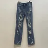 Jeans femininos de primavera/verão de primavera/verão com cintura alta para a tendência da moda de emagrecimento 240319