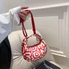 Sprzedaje designerskie torby damskie na granicy listed torba pod pachami dla damskiej nowej modnej drukowanej ręki na ramię