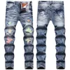 2022 Höst/vinterljusfärgade lappade jeans med hål, mäns gränslösa blå små fötter, personliga trend långa byxor