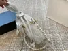 Bolso de hombro a la moda de diseñador de lujo, bolso tipo cubo de alta calidad, cartera cruzada con flores para mujer, bolso con cordón para mujer