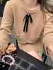 ワークドレス女性編みセーターハーフスカートスーツ秋の冬の短い弓トップソリッドカーキブラック女性気質プルオーバー2ピースセット