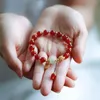 Charm armband röda bönor kristall armband retro kinesisk stil elegant persika blommor tofs elastisk armband kvinna