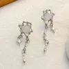 Boucles d'oreilles pendantes Love Starlight, pompon asymétrique pour filles, croix douce, chaîne en métal Zircon pour femmes, bijoux