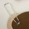 Collier de créateur, collier de perles Saturne classique, chaîne de clavicule baroque irrégulière pour femmes, design de niche, collier européen et américain
