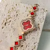 Light Luksusowa damska moda czterech trawy zaawansowana sens nowa czerwona mniejszości Diamond Inklaid Watch Batch