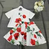 Populära babykläder Kids Tracksuits Girls Dress Two-Piece Set Storlek 110-160 cm Röd blomma och gröna bladmönster T-shirt och kort kjol 24mar