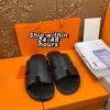 Designer Hommes Pantoufles Sandales Izmir Flip Flop Cuir Heritage Sandales En Cuir De Veau Été Paresseux Grande Mode Maison Plage Casual Diapositives Noir