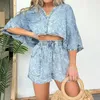 Kvinnors träningsdräkter Elegant Casual Denim Loose Set Female Lapel Button Shirt Topps Lace-Up Pocket Shorts Fashion High Street Water Wash