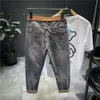 Designer jeans Nya avancerade jeans för mäns koreanska stretch smala passande små benbyxor för mäns casual och mångsidiga bantning beskärda byxor för män