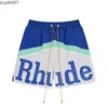 Men Shorts Designer علامة تجارية أمريكان أزياء Rhude Patchwork Letter Print Draystring غير رسمية على التوالي من الرجال والرياضات النسائية للصيف