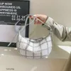 Designer lyxiga mode axelväskor handväska för kvinnor koreansk mode små doftande stil färgglada linjer rutiga casual dumplings underarmspåse singel axel cro