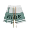 Mäns shorts designer märke europeiska och amerikanska mode rhude lapptäcke kontrasterande jacquard bokstav lös casual trendiga mens stickade med en femdel byxor