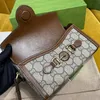 Designer bolsa de ombro frete grátis couro original nova família kuqi cavalo fivela seri mini bolsa ombro único msenger caixa crianças