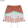 Men Shorts Designer علامة تجارية أمريكان أزياء Rhude Patchwork Letter Print Draystring غير رسمية على التوالي من الرجال والرياضات النسائية للصيف