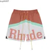 Shorts pour hommes Marque de créateurs Mode américaine Rhude Patchwork Lettre Imprimer Cordon de serrage Casual Lâche Coupe droite Hommes et femmes Sports pour l'été