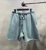 Shorts pour hommes Un nouveau short en caoutchouc coloré incontournable pour l'été 2023, vêtements d'extérieur de haute qualité, shorts brossés, vêtements de rue à la mode pour hommes 24323