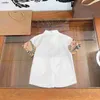 Vêtements de créateurs pour enfants populaires Vérification d'épissage design de la chemise bébé Taille de bébé 110-160 cm de haute qualité Girls à manches courtes Blouses 24MA