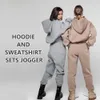 Anpassade kvinnors överdimensionerade tomma grödor tröja Sweatpants Tracksuit jogger slitage Sweatsuit och hoodie sport slitage set för kvinnor