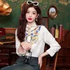 女性用ブラウスエレガントな中国スタイルの女性Y2Kフローラルプリントボタンブラウスカジュアル2024春のOネック長袖刺繍シャツファッション