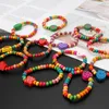Braccialetti con ciondoli Lucky Stretch 12 pezzi colorato braccialetto da surfista da spiaggia in legno regalo di gioielli per bambine bambini donne