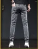 Jeans masculinos cinza denim masculino calças elásticas moda longa fina alta rua pés pequenos calças
