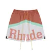 Mäns shorts American Fashion Märke Rhude Patchwork Letter Print Drawstring Casual Loose Straight Fit Men and Womens Sports Shorts för sommaren