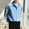 Camisa de manga longa de outono para homens compridos Bolsa coreana da moda sem ferro, elástico casual de lapela camisa branca azul 240323