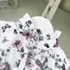 Popularny projektant ubrania dla dzieci sukienki dla dziewcząt Butterfly kwiat drukujący dziecięcą spódnicę koronkową sukienkę księżniczki Rozmiar 90-150 cm Baby sukiena 24mar