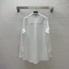 Damesblouses 2024 Mode Veelzijdige voorzak Geborduurde flip-kraag Shirt met lange mouwen