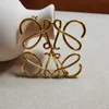 loewve brooch hollow simple lines twist flower love meaning personalized fashion exaggerated brooch