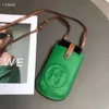 Netröd mobiltelefonpåse koreansk mode kvinnors väska riktig läderväska noll plånbok kortväska ny färg en axel liten väska mode