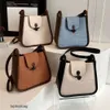 Designer Luxury fashion Shoulder bags Korean version of Sweet Cow Horn Button Letter Bag 2023 Versatile Western Style One Shoulder Crossbody Bucket Bag