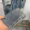 Designer jeans vår/sommaren förenklade europeiska mäns jeans high end trendiga varumärke tungt hantverk tvättade europeiska varor elastiska smala passform små ben jeans